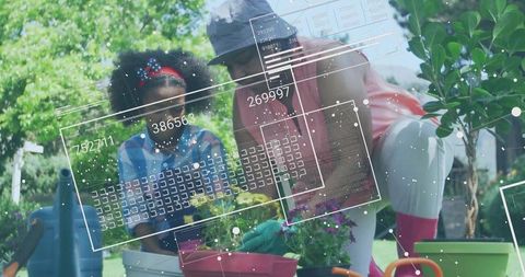 Gardening Together Grandmother Shows Granddaughter Planting flowers