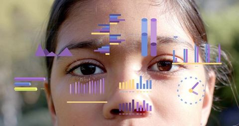 Gazing child with colorful data overlays and infographics on face representing future analytics