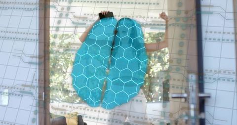 Adult woman interacting with holographic brain interface for smart home control