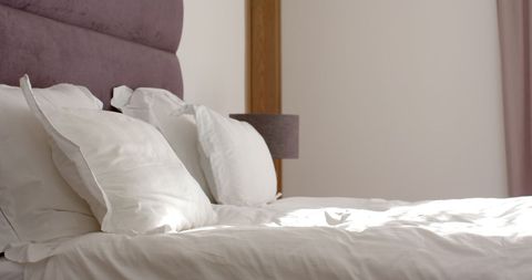 Elegant Bedroom with White Linens and Plush Purple Headboard - Download Free Stock Images Pikwizard.com