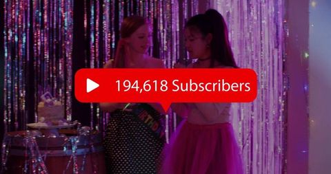 Subscriber milestone celebration with two young women singing karaoke at glitter backdrop