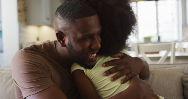 Happy father hugging daughter in cozy home living room - Download Free Stock Images Pikwizard.com