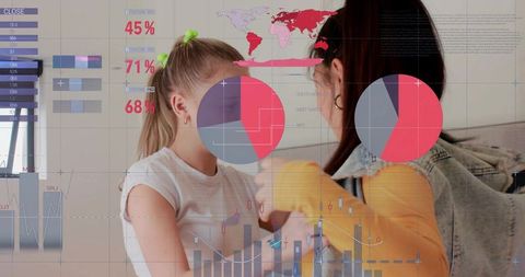 Young women comparing data visualizations in living room collaborating over pie charts