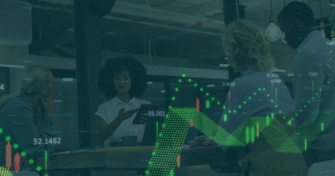 Team Analyzing Financial Charts in Modern Office Environment