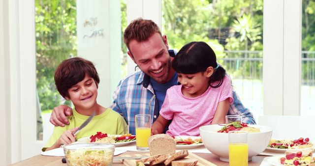 Happy Family Enjoying Breakfast at Home Together - Download Free Stock Images Pikwizard.com