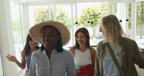 Diverse Group of Female Friends Arriving at Vacation Home