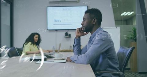 Business professional analyzing charts in modern conference room