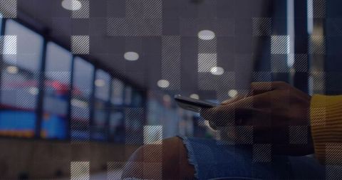 Stylish Woman Relaxing with Smartphone in Airport Terminal