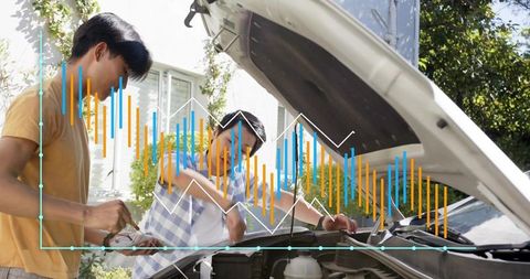 Hands-on car maintenance workshop with adult and teen inspecting engine, analytics overlay
