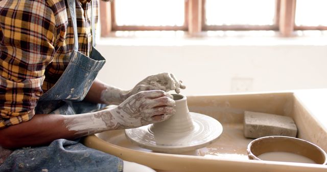 Artisan Creating Pottery on Spinning Wheel in Studio - Download Free Stock Images Pikwizard.com