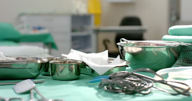 Medical tools, sterilized and organized, lie ready on an operating room table, which is suitable for educational materials, medical articles, presentations, and healthcare advertisements emphasizing cleanliness and readiness for surgeries.