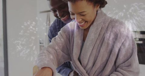 Happy couple cooking at home, embracing cozy lifestyle