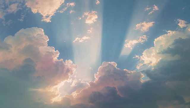 Sun Ray Streaming Cumulus Clouds with Pastel Sky