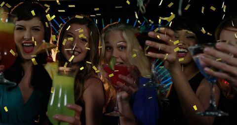 Joyful Friends Celebrating at Club with Drinks and Confetti - Download Free Stock Images Pikwizard.com