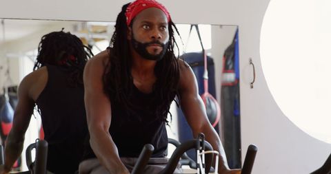 Boxer Training on Exercise Bike in Gym for Cardio
