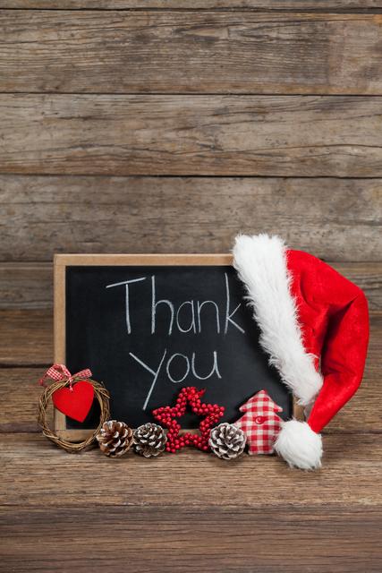 Thank You Message on Slate with Christmas Decorations on Wooden Table - Download Free Stock Photos Pikwizard.com