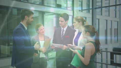 Diverse Business Team Discussing Project with Technology Overlay