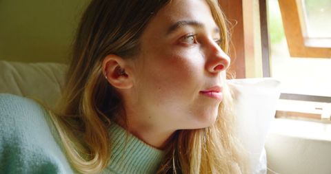 Thoughtful Teenage Girl Looking Through Home Window - Download Free Stock Images Pikwizard.com