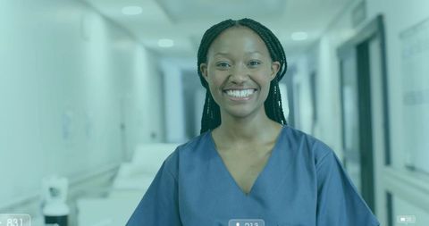 Smiling Nurse in Hospital Corridor Promoting Healthcare Professionalism