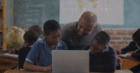 Teacher Supporting Students with Laptop and Math Concepts Overlay - Download Free Stock Images Pikwizard.com