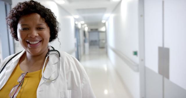 Smiling Nurse in Hospital Corridor with Stethoscope - Download Free Stock Images Pikwizard.com