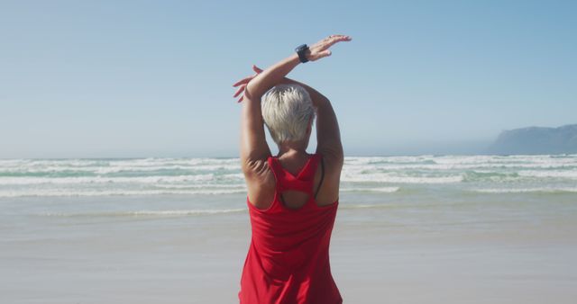 Active Senior Woman Stretching on Ocean Beach - Download Free Stock Images Pikwizard.com