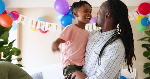 Father and Son Celebrating Birthday with Joyful Smiles