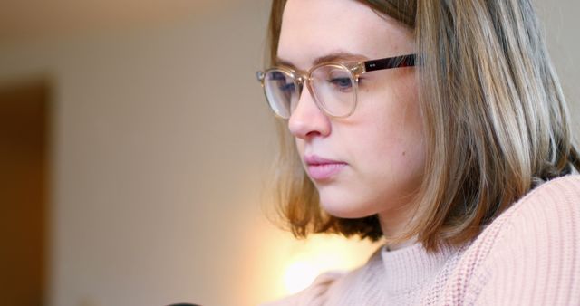 Focused Young Woman With Glasses Working at Home - Download Free Stock Images Pikwizard.com