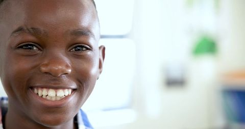 Smiling African American Boy in Bright Study Setting