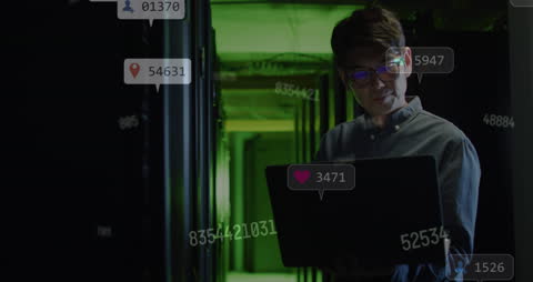 Technician Monitoring Servers Amid Digital Interface