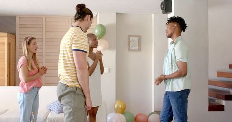 Friends Gather at Home for Lively Celebration with Laughter