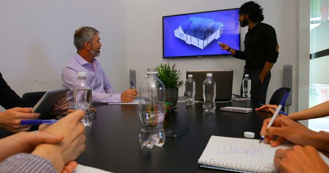 Engineer Presenting Architectural Design to Business Team in Meeting Room - Download Free Stock Images Pikwizard.com