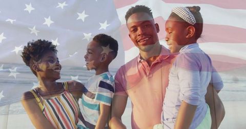 Happy family on beach with american flag overlay celebrating unity