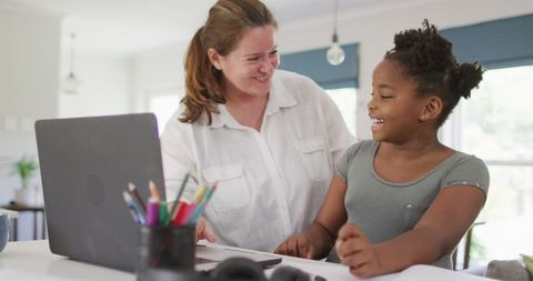 Mother and Daughter Enjoying Collaborative Homework Time - Download Free Stock Images Pikwizard.com