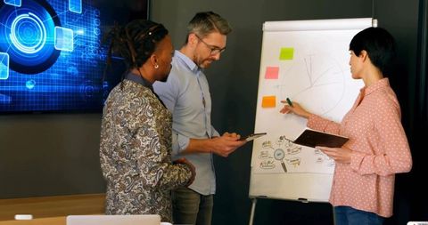 Business Team Collaborating on Innovative Strategies in Modern Office