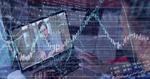 Laptop Showing Remote Trading Presenter with Overlaid Financial Charts