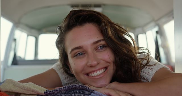 Smiling Woman Relaxing in Camper Van Interior During Road Trip - Download Free Stock Images Pikwizard.com