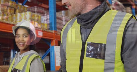 Warehouse workers analyzing data for global shipping connections