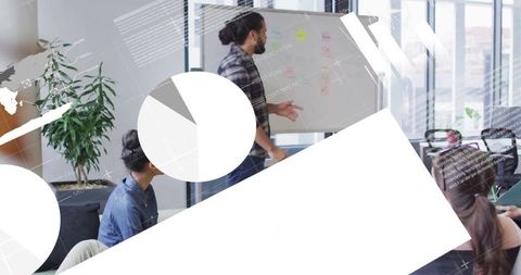 Colleagues Brainstorming with Financial Data Overlay in Modern Office