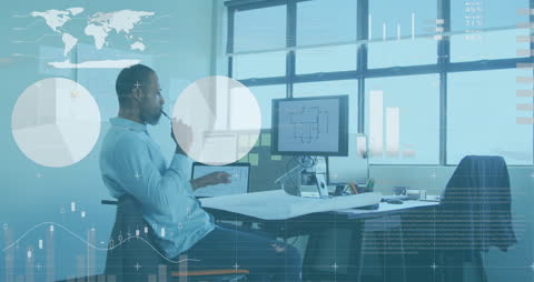 Businessman Analyzing Data on Computer with Global Concepts Overlay