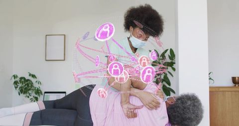 Home caregiver supporting senior during mobility exercise with digital health overlay