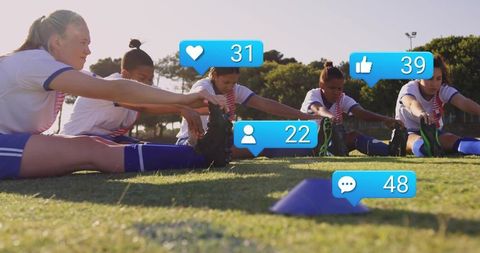 Female soccer team stretching at sunset with social media engagement overlays