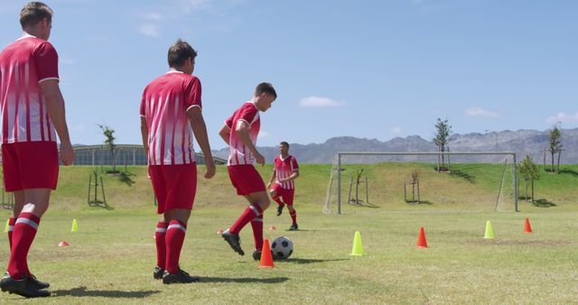 Soccer players practicing dribbling skills during training session outdoors - Download Free Stock Images Pikwizard.com