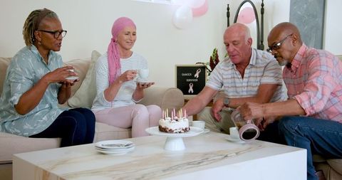 Senior Friends Celebrating with Coffee and Cake at Home