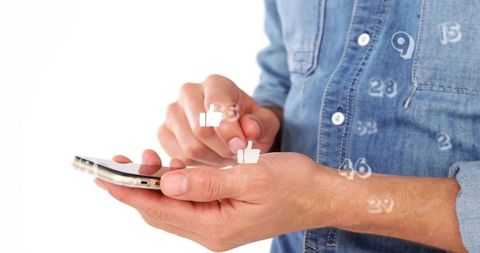 Hands tapping smartphone showing floating thumbs-up icons and social media counters