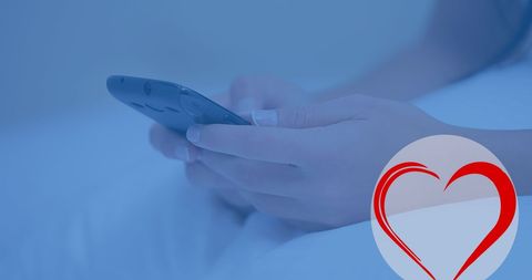 Hands Holding Smartphone with Heart Icon Conveying Love and Connection