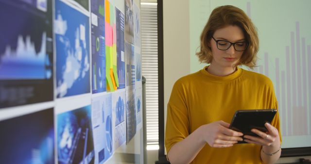 Businesswoman Using Tablet in Modern Office with Data Charts - Download Free Stock Images Pikwizard.com