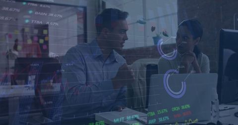 Business professionals discussing stock market data analysis in office