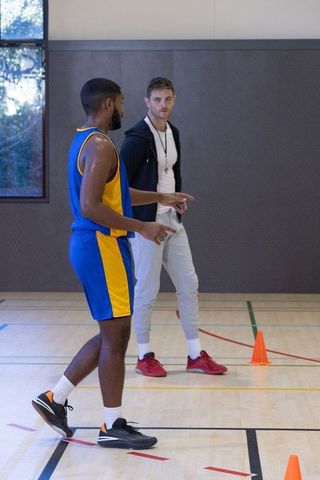 Basketball Coach Training Player With Court Drills for Team Building