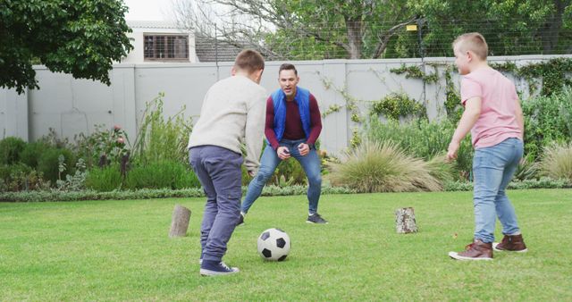 Father Playing Soccer with Two Sons in Backyard - Download Free Stock Images Pikwizard.com